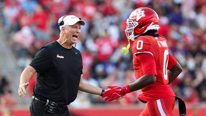 Nov 22, 2025; Houston, Texas, USA; Houston Cougars head coach Willie Fritz celebrates with wide receiver Amare Thomas (0) after Thomas scores a touchdown during the second quarter against the TCU Horned Frogs at TDECU Stadium. Mandatory Credit: Troy Taormina-Imagn Images Nov 22, 2025; Houston, Texas, USA; Houston Cougars head coach Willie Fritz celebrates with wide receiver Amare Thomas (0) after Thomas scores a touchdown during the second quarter against the TCU Horned Frogs at TDECU Stadium. Mandatory Credit: Troy Taormina-Imagn Images