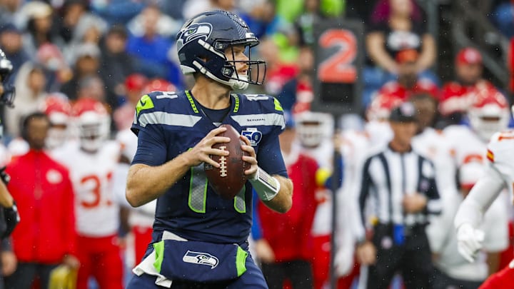 Aug 15, 2025; Seattle, Washington, USA; Seattle Seahawks quarterback Sam Darnold (14) looks to pass against the Kansas City Chiefs during the first quarter at Lumen Field. Mandatory Credit: Joe Nicholson-Imagn Images