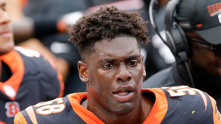 Former Cincinnati Bengals defensive end Carl Lawson walks the sideline