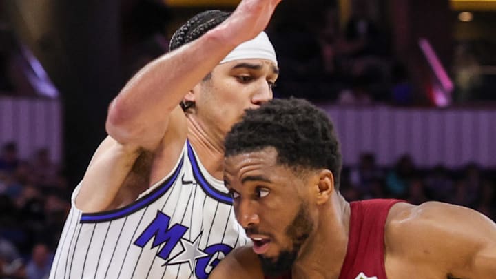 Cleveland Cavaliers guard Donovan Mitchell drives to the basket against Orlando Magic guard Anthony Black.