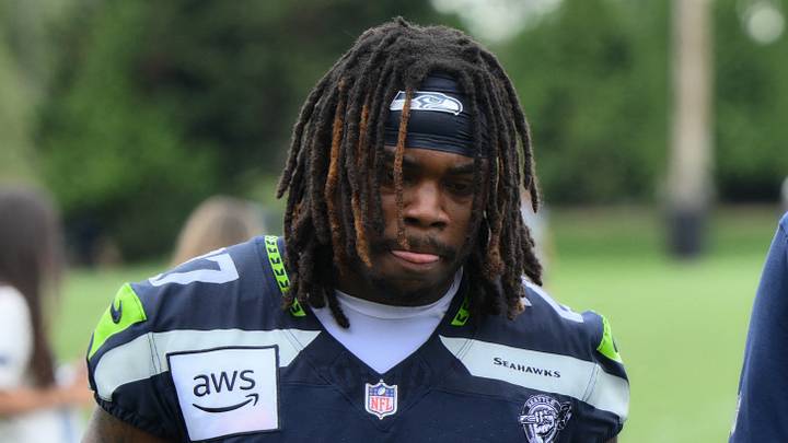 Seattle Seahawks running back Emanuel Wilson (27) looks down