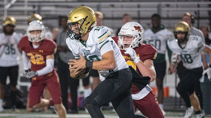 Iowa City West's Jack Wallace runs the ball during the Ankeny and Iowa City West football game on Friday, Sept. 27, 2024, in Ankeny.