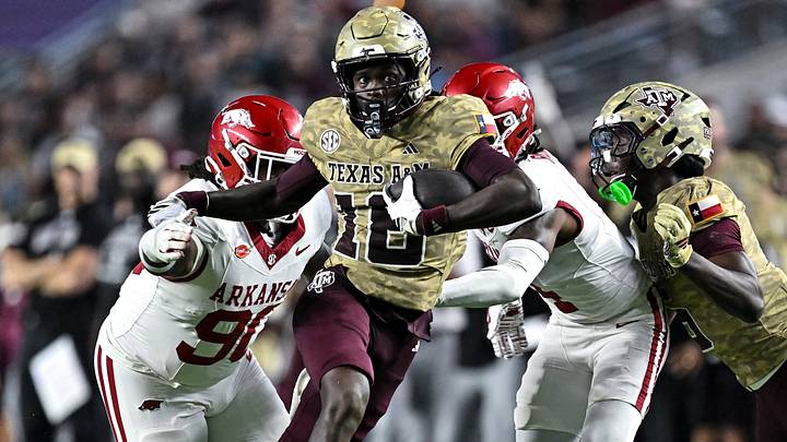 Texas A&M Aggies wide receiver Tk Norman (18) runs the ball during the fourth quarter against the Arkansas Razorbacks at Kyle Field. Texas A&M Aggies wide receiver Tk Norman (18) runs the ball during the fourth quarter against the Arkansas Razorbacks at Kyle Field.