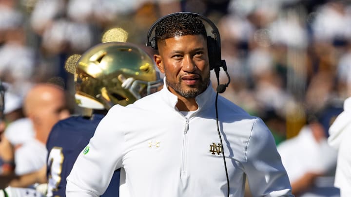 Oct 11, 2025; South Bend, Indiana, USA; Notre Dame Fighting Irish head coach Marcus Freeman looks to the scoreboard against the NC State Wolfpack during the first half at Notre Dame Stadium. Oct 11, 2025; South Bend, Indiana, USA; Notre Dame Fighting Irish head coach Marcus Freeman looks to the scoreboard against the NC State Wolfpack during the first half at Notre Dame Stadium.