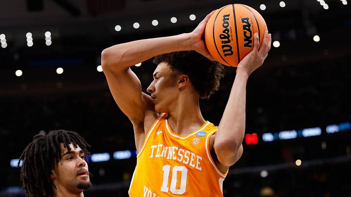 Mar 29, 2026; Chicago, IL, USA; Tennessee Volunteers forward Nate Ament (10) looks to pass while defended by Michigan Wolverines guard Elliot Cadeau (3) in the first half during an Elite Eight game of the Midwest Regional of the men's 2026 NCAA Tournament at United Center. Mandatory Credit: Kamil Krzaczynski-Imagn Images