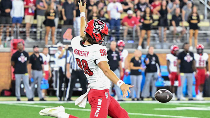 Sep 11, 2025; Winston-Salem, North Carolina, USA;  North Carolina State Wolfpack punter Caden Noonkester (98) punts the ball against Wake Forest Demon Deacons at Allegacy Federal Credit Union Stadium. Mandatory Credit: Luke Jamroz-Imagn Images