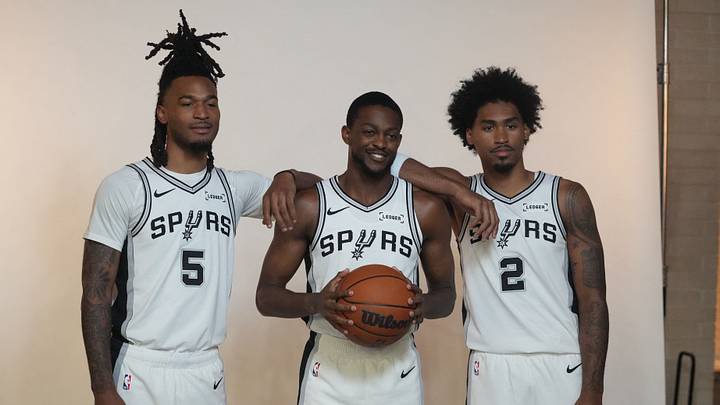 Sep 28, 2026; San Antonio, TX, USA; San Antonio Spurs guards Stephon Castle (5), De'Aaron Fox (4) and Dylan Harper (2) pose for photos during Media Day at Victory Capital Performance Center in San Antonio, Texas. Sep 28, 2026; San Antonio, TX, USA; San Antonio Spurs guards Stephon Castle (5), De'Aaron Fox (4) and Dylan Harper (2) pose for photos during Media Day at Victory Capital Performance Center in San Antonio, Texas.