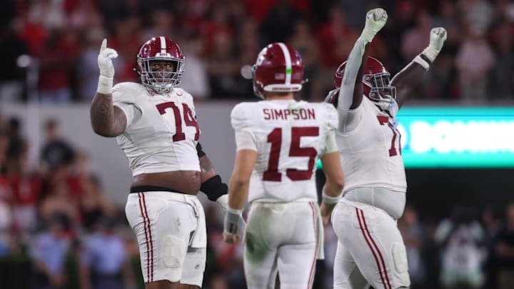 Sep 27, 2025; Athens, Georgia, USA; Alabama Crimson Tide offensive lineman Kadyn Proctor (74) celebrates with quarterback Ty Simpson (15) after defeating the Georgia Bulldogs at Sanford Stadium. Mandatory Credit: Brett Davis-Imagn Images