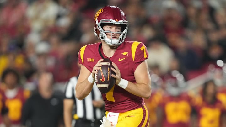 Oct 25, 2024; Los Angeles, California, USA; Southern California Trojans quarterback Miller Moss (7) throws the ball against the Rutgers Scarlet Knights in the first half at United Airlines Field at Los Angeles Memorial Coliseum. Mandatory Credit: Kirby Lee-Imagn Images Oct 25, 2024; Los Angeles, California, USA; Southern California Trojans quarterback Miller Moss (7) throws the ball against the Rutgers Scarlet Knights in the first half at United Airlines Field at Los Angeles Memorial Coliseum. Mandatory Credit: Kirby Lee-Imagn Images