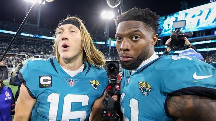 Jan 14, 2023; Jacksonville, Florida, USA; Jacksonville Jaguars quarterback Trevor Lawrence (16) and linebacker Josh Allen (41) celebrate after beating the Los Angeles Chargers in a wild card game at TIAA Bank Field. 