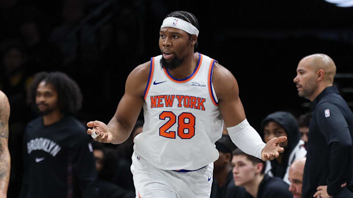 Nov 24, 2025; Brooklyn, New York, USA; New York Knicks forward Guerschon Yabusele (28) reacts in front of Brooklyn Nets guard Tyrese Martin (13) during the second half at Barclays Center. Mandatory Credit: Vincent Carchietta-Imagn Images