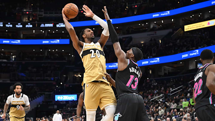 Feb 8, 2026; Washington, District of Columbia, USA;  Washington Wizards center Alex Sarr (20) attempts a shot over Miami Heat center Bam Adebayo (13) during the third quarter at Capital One Arena. Mandatory Credit: Rafael Suanes-Imagn Images