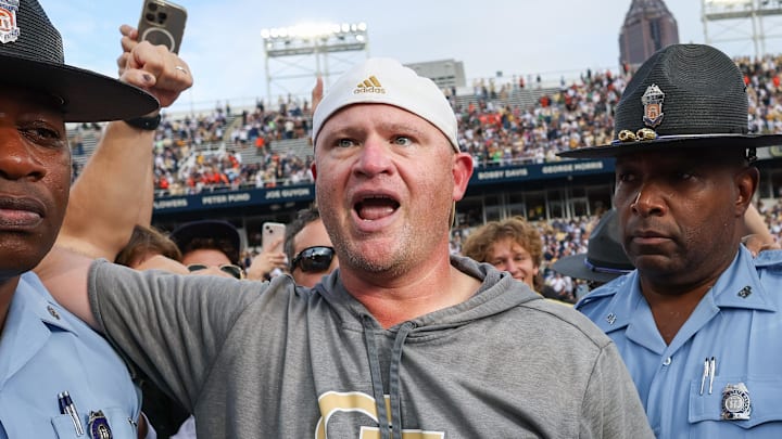Nov 9, 2024; Atlanta, Georgia, USA; Georgia Tech Yellow Jackets head coach Brent Key celebrates after a victory over the Miami Hurricanes at Bobby Dodd Stadium at Hyundai Field. Mandatory Credit: Brett Davis-Imagn Images