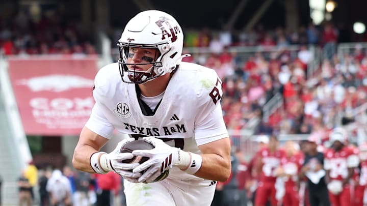 Oct 18, 2025; Fayetteville, Arkansas, USA; Texas A&M Aggies tight end Nate Boerkircher (87) scores a touchdown in the second quarter against the Arkansas Razorbacks at Donald W. Reynolds Razorback Stadium. Mandatory Credit: Nelson Chenault-Imagn Images