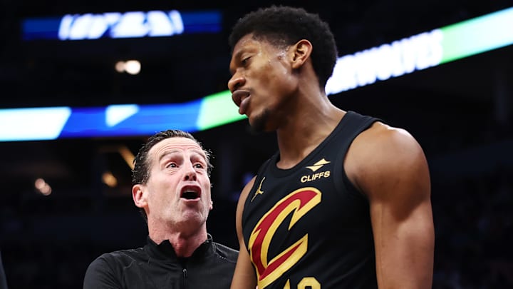 De'Andre Hunter speaks to Cleveland Cavaliers coach Kenny Atkinson