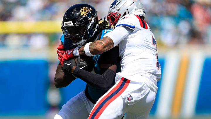 Jacksonville Jaguars wide receiver Brian Thomas Jr. (7) is tackled by New England Patriots cornerback Carlton Davis III (7) during the second quarter of an NFL football matchup at EverBank Stadium on Sunday, Sept. 27, 2026, in Jacksonville, Fla. The Jaguars defeated the Patriots 35-6. [Corey Perrine/Florida Times‑Union]
