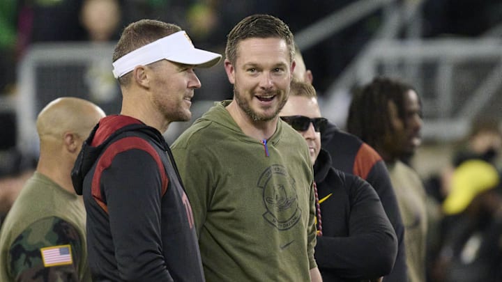 Nov 11, 2023; Eugene, Oregon, USA; USC Trojans head coach Lincoln Riley, left, and Oregon Ducks head coach Dan Lanning talk before a game at Autzen Stadium. 