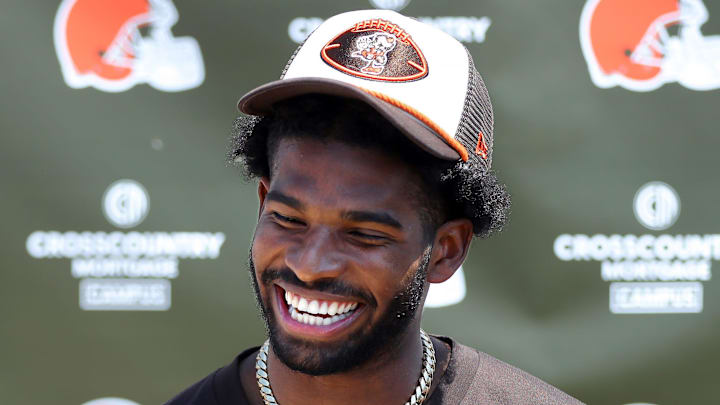 Cleveland Browns quarterback Shedeur Sanders (12) jokes about his signing bonus during a press conference before day two of NFL rookie minicamp at the Cleveland Browns training facility on Saturday, May 10, 2025, in Berea, Ohio.