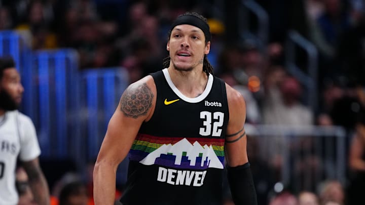 Apr 4, 2026; Denver, Colorado, USA; Denver Nuggets forward Aaron Gordon (32) reacts to his three point score in the second half against the San Antonio Spurs at Ball Arena.