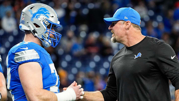 Detroit Lions head coach Dan Campbell shakes hands with center Frank Ragnow (77). Detroit Lions head coach Dan Campbell shakes hands with center Frank Ragnow (77).