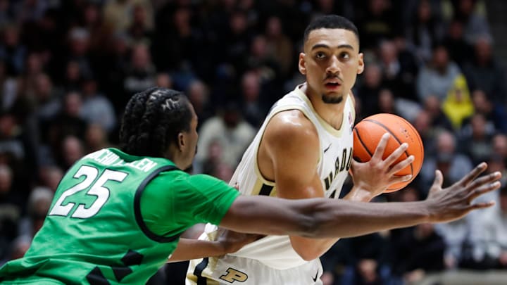 Marshall Thundering Herd forward Obinna Anochili-Killen defends Purdue Boilermakers forward Trey Kaufman-Renn 