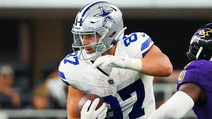 Dallas Cowboys tight end Jake Ferguson runs with the ball as Baltimore Ravens linebacker Roquan Smith defends. Dallas Cowboys tight end Jake Ferguson runs with the ball as Baltimore Ravens linebacker Roquan Smith defends.