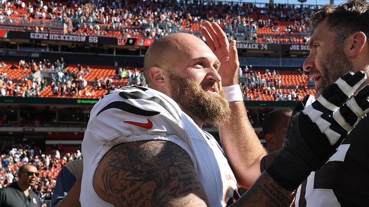 Sep 7, 2025; Cleveland, Ohio, USA; Cincinnati Bengals guard Dalton Risner (66) and Cleveland Browns quarterback Joe Flacco (15) greet each other after a game at Huntington Bank Field. Mandatory Credit: Scott Galvin-Imagn Images