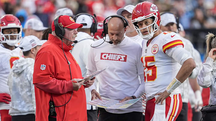 Kansas City Chiefs head coach Andy Reid talks with quarterback Patrick Mahomes (15) during a time out during the second half against the Carolina Panthers at Bank of America Stadium.