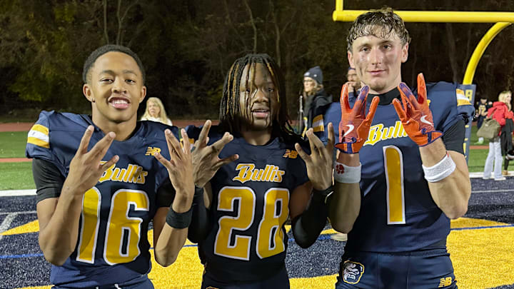 Bullis stars Quincy Wilson (16), Cameron Homer (28) and Connor Salmin (1), a Clemson commit, celebrate the Bulldogs' 13-12 win over Georgetown Prep, to capture a share of the the 2025 IAC Championship. Wilson had an interception and Salmin scored the go ahead touchdown. Bullis stars Quincy Wilson (16), Cameron Homer (28) and Connor Salmin (1), a Clemson commit, celebrate the Bulldogs' 13-12 win over Georgetown Prep, to capture a share of the the 2025 IAC Championship. Wilson had an interception and Salmin scored the go ahead touchdown.