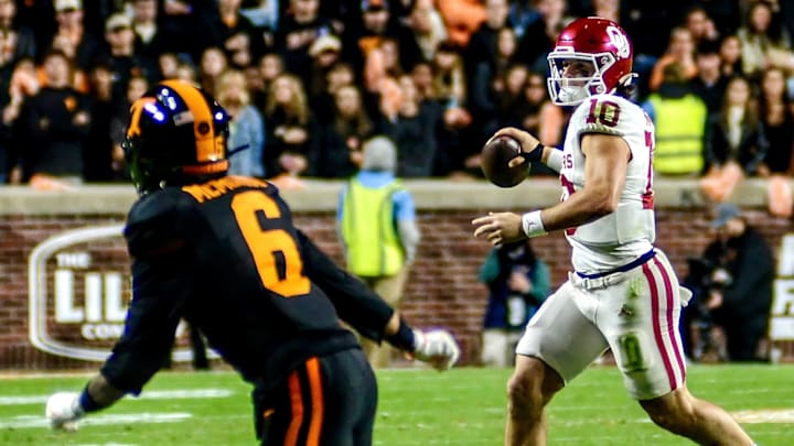 Oklahoma quarterback John Mateer rolls out against Tennessee. Oklahoma quarterback John Mateer rolls out against Tennessee.