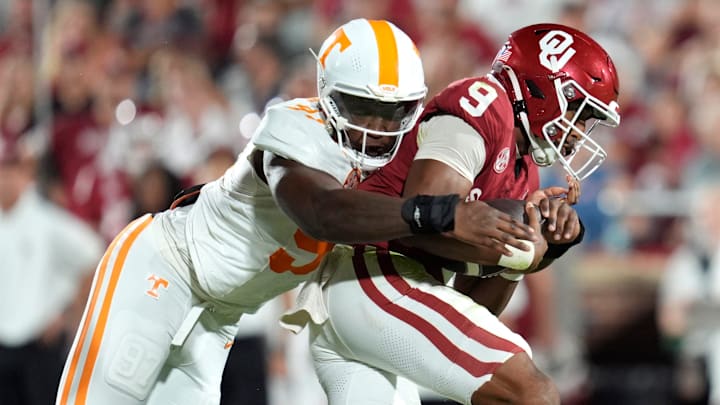 Oklahoma Sooners quarterback Michael Hawkins Jr. (9) is brought down by Tennessee Volunteers defensive lineman Jayson Jenkins (97) during a college football game between the University of Oklahoma Sooners (OU) and the Tennessee Volunteers at Gaylord Family - Oklahoma Memorial Stadium in Norman, Okla., Saturday, Sept. 21, 2024.