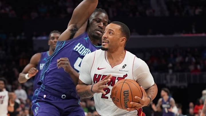 Mar 17, 2026; Charlotte, North Carolina, USA; Miami Heat guard Norman Powell (24) goes to the basket against Charlotte Hornets guard Sion James (4) during the second half at Spectrum Center. Mandatory Credit: Jim Dedmon-Imagn Images