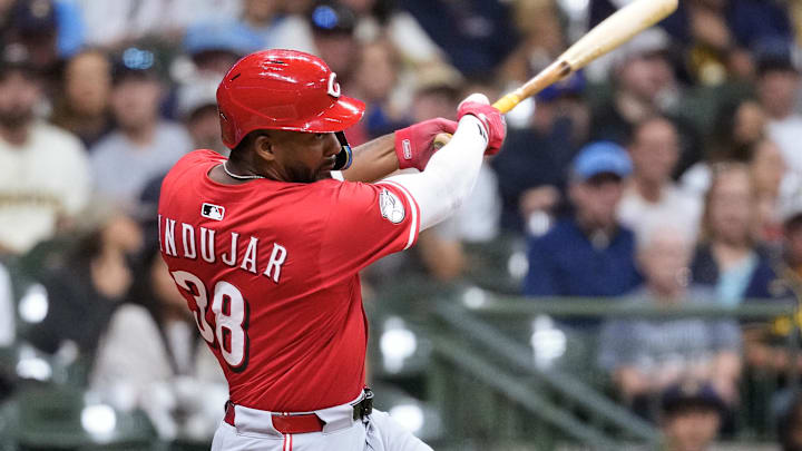 Sep 26, 2025; Milwaukee, Wisconsin, USA;  Cincinnati Reds left fielder Miguel Andujar (38) hits an RBI single during the sixth inning against the Milwaukee Brewers at American Family Field. Mandatory Credit: Jeff Hanisch-Imagn Images