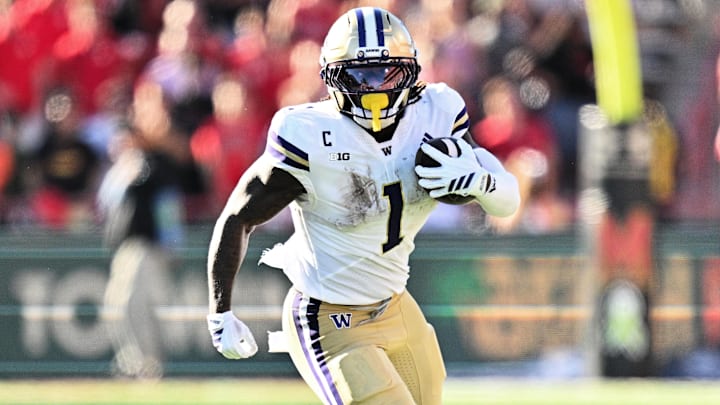Oct 4, 2025; College Park, Maryland, USA;  Washington Huskies running back Jonah Coleman (1) carries the ball against the Maryland Terrapins at SECU Stadium.