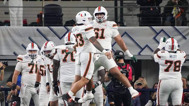 Dec 31, 2025; Arlington, TX, USA; Miami Hurricanes offensive line Francis Mauigoa (61) celebrates in the second quarter against the Ohio State Buckeyes during the 2025 Cotton Bowl and quarterfinal game of the College Football Playoff at AT&T Stadium. Mandatory Credit: Raymond Carlin III-Imagn Images