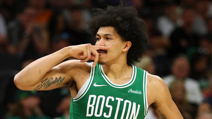 Feb 24, 2026; Phoenix, Arizona, USA; Boston Celtics guard Ron Harper Jr. (13) celebrates a three point shot against the Phoenix Suns in the second half at Mortgage Matchup Center. Mandatory Credit: Mark J. Rebilas-Imagn Images