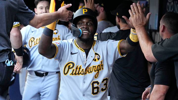 Aug 13, 2025; Milwaukee, Wisconsin, USA; Pittsburgh Pirates outfielder Ronny Simon (63) celebrates a home run by outfielder Bryan Reynolds against the Milwaukee Brewers in the sixth inning at American Family Field. Mandatory Credit: Michael McLoone-Imagn Images