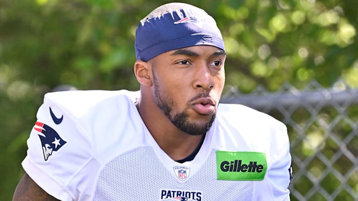 Jul 28, 2025; Foxborough, MA, USA; New England Patriots running back TreVeyon Henderson (32) heads to the practice fields for training camp at Gillette Stadium. Mandatory Credit: Eric Canha-Imagn Images