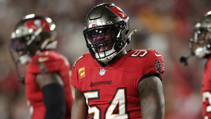 Jan 12, 2025; Tampa, Florida, USA; Tampa Bay Buccaneers linebacker Lavonte David (54) celebrates after a stop during the fourth quarter of a NFC wild card playoff against the Washington Commanders at Raymond James Stadium. Mandatory Credit: Nathan Ray Seebeck-Imagn Images
