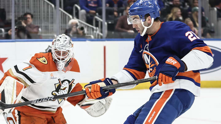 Oct 29, 2024; Elmont, New York, USA;  Anaheim Ducks goaltender Lukas Dostal (1) defends against a shot on goal attempt by New York Islanders center Kyle Palmieri (21) in the second period at UBS Arena. Mandatory Credit: Wendell Cruz-Imagn Images