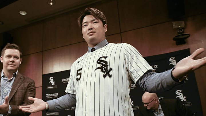 Dec 22, 2025; Chicago, Il, USA;  New Chicago White Sox player Munetaka Murakami, right, dons his jersey with General Manager Chris Getz, left,  during a press conference  where he was introduced at Rate Field. Mandatory Credit: Matt Marton-Imagn Images