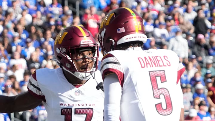 Nov 3, 2024; East Rutherford, New Jersey, USA; Washington Commanders wide receiver Terry McLaurin (17) after a 1st quarter towchdown reception from quarterback Jayden Daniels (5) against the New York Giants at MetLife Stadium. Mandatory Credit: Robert Deutsch-Imagn Images Nov 3, 2024; East Rutherford, New Jersey, USA; Washington Commanders wide receiver Terry McLaurin (17) after a 1st quarter towchdown reception from quarterback Jayden Daniels (5) against the New York Giants at MetLife Stadium. Mandatory Credit: Robert Deutsch-Imagn Images