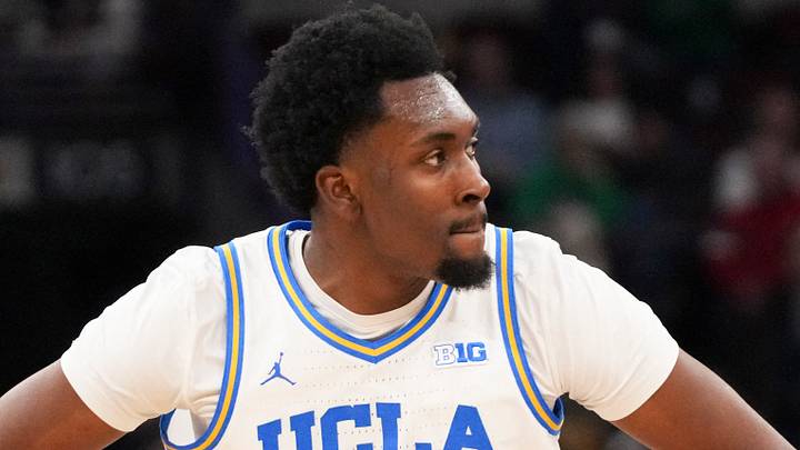Mar 14, 2026; Chicago, IL, USA; UCLA Bruins center Xavier Booker (1) reacts after making a three point basket against the Purdue Boilermakers during the first half at United Center. Mandatory Credit: David Banks-Imagn Images