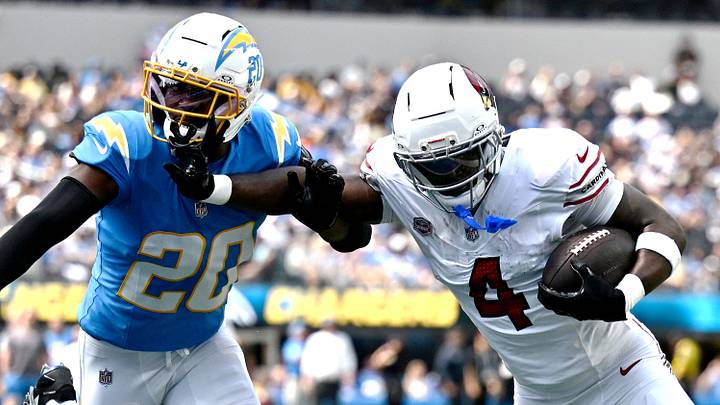 Sep 13, 2026; Inglewood, California, USA; Arizona Cardinals running back Jeremiyah Love (4) fight his way into the endzone for a touchdown as Los Angeles Chargers cornerback Cam Hart (20) dfends during the first quarter at SoFi Stadium. Mandatory Credit: William Liang-Imagn Images Sep 13, 2026; Inglewood, California, USA; Arizona Cardinals running back Jeremiyah Love (4) fight his way into the endzone for a touchdown as Los Angeles Chargers cornerback Cam Hart (20) dfends during the first quarter at SoFi Stadium. Mandatory Credit: William Liang-Imagn Images