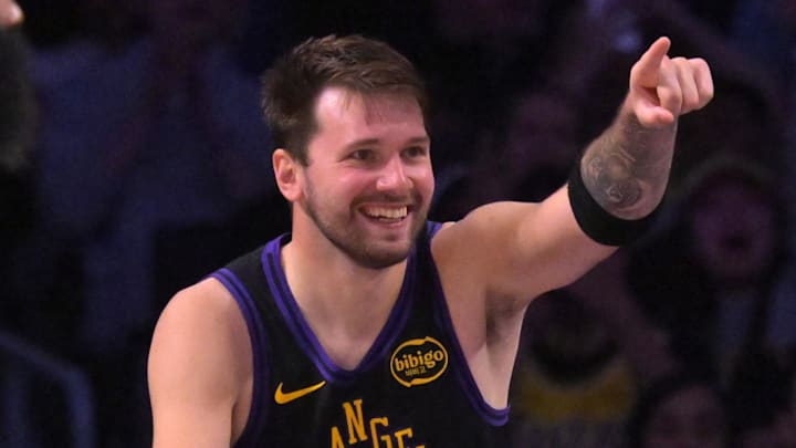 Mar 31, 2026; Los Angeles, California, USA;  Los Angeles Lakers guard Luka Doncic (77) reacts after a basket in the second half against the Cleveland Cavaliers at Crypto.com Arena. Mandatory Credit: Jayne Kamin-Oncea-Imagn Images