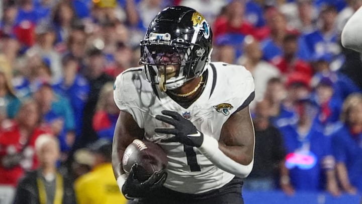 Sep 23, 2024; Orchard Park, New York, USA; Jacksonville Jaguars running back Travis Etienne Jr. (1) runs during the second half against the Buffalo Bills at Highmark Stadium. Mandatory Credit: Gregory Fisher-Imagn Images