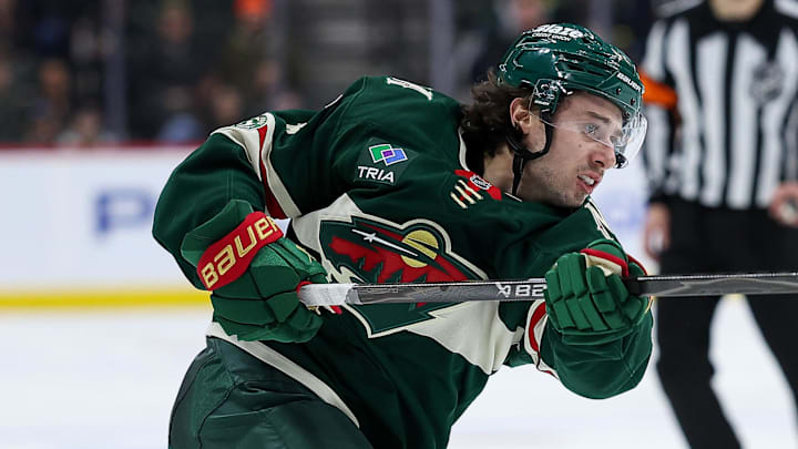 Jan 15, 2026; Saint Paul, Minnesota, USA; Minnesota Wild defenseman Quinn Hughes (43) shoots the puck against the Winnipeg Jets during the third period at Grand Casino Arena. Mandatory Credit: Matt Krohn-Imagn Images