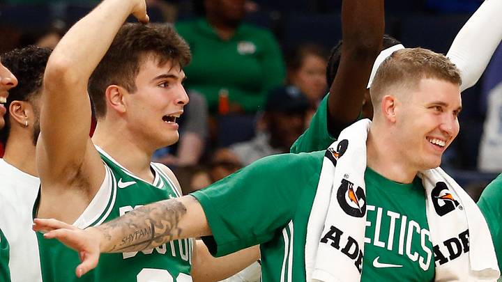 Oct 8, 2025; Memphis, Tennessee, USA; Boston Celtics guard Hugo Gonzalez (28), forward Baylor Scheierman (55) and center Luka Garza (52) react during the second quarter against the Memphis Grizzlies at FedExForum. Mandatory Credit: Petre Thomas-Imagn Images