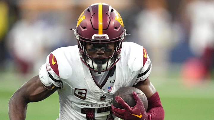 Dec 17, 2023; Inglewood, California, USA; Washington Commanders wide receiver Terry McLaurin (17) carries the ball against the Los Angeles Rams in the second half at SoFi Stadium. Mandatory Credit: Kirby Lee-Imagn Images