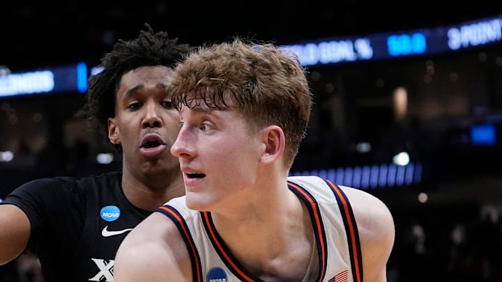 Xavier guard Dailyn Swain (3) guards Illinois guard Kasparas Jakucionis (32) during the second half of their first round NCAA men’ s basketball tournament game on Friday March 21, 2025 at Fiserv Forum in Milwaukee, Wis.